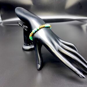 Royal Couture turquoise and gold bead pull cord bracelet